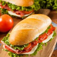 Classic Sub · A cold sub with ham and provolone with lettuce, tomato and onion, drizzled with vinegar and ...