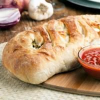Sam's Stromboli · Smoked sausage, pepperoni, beef, and ham baked to perfection with a side of marinara