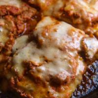 Veal Parmigiana · Seasoned and lightly breaded veal with marinara sauce, house-shredded mozzarella cheese, and...