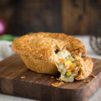 Chicken Pot Pie · Chicken, onions, carrots, celery, green beans, corn and peas in our flaky crust.