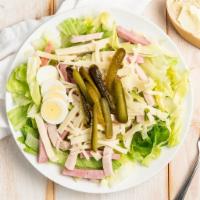 Hudson’s Maurice Salad · Iceberg lettuce, ham, turkey, Swiss cheese, gherkin pickles and a hard boiled egg with Mauri...