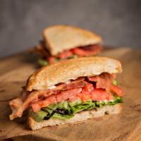 BLT Sandwich · Bacon, fresh lettuce, tomato and mayo on sourdough bread. Served with a pickle and choice of...