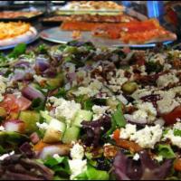 Salad Pie · Mesclun salad, feta, tomatoes, onions and balsamic glaze.