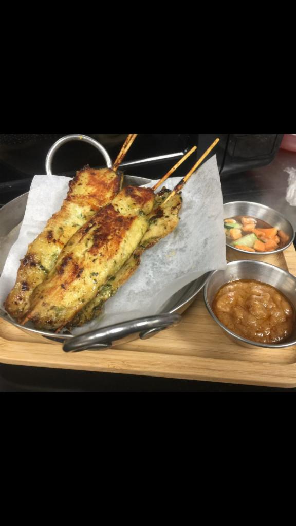 Chicken Satay · Marinated grilled chicken on skewers  served with sweet cucumber relish & peanut sauce.