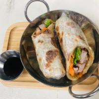 Duck Wrap · Crispy roasted duck, carrot, cucumber, celery wrapped in roti bread and served with hoisin s...