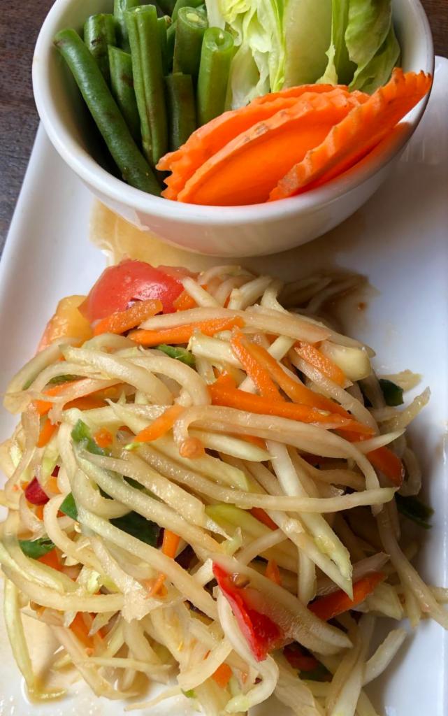 Green Papaya Salad (vegan) · Green papaya, chili, garlic, carrot, string bean and tomato and peanut