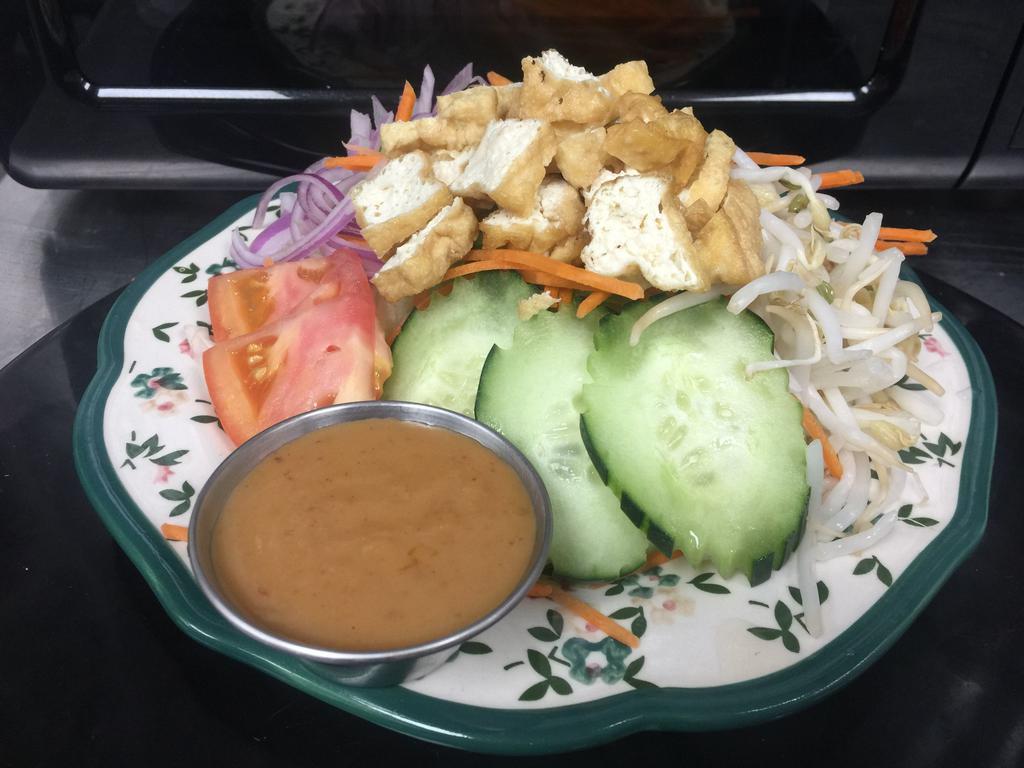 Thai Style Salad (vegan) · Lettuce, tomato, shallot, bean sprout,  with side of peanut dressing.