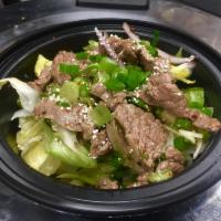 Nam Tok Beef Salad · Lettuce, scallion, shallot, lime leaf and roasted rice powder in Thai spicy dressing.