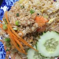 Crab Meat Fried Rice · Fried rice with onion, scallion, egg and crab meat on top.