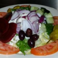 Greek Salad · Served with lettuce, feta cheese, Kalamata olives, pepperoncini, onions, tomatoes, beets and...