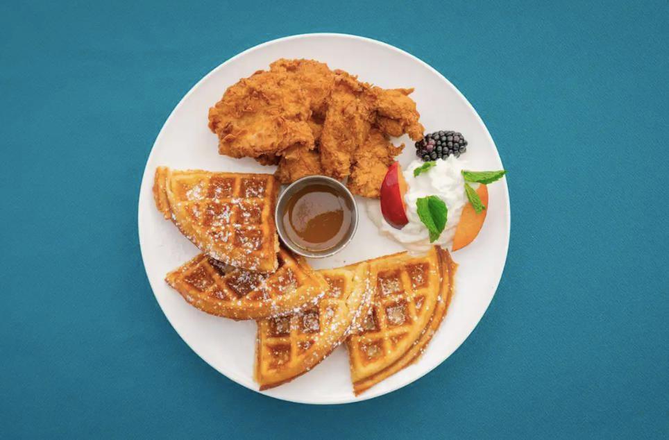 Georgia's peach Chicken and Waffles · Buttermilk Fried Chicken with peach honey syrup and vanilla waffle.