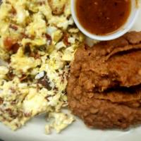 Bacon and Eggs Plate · Scrambled Eggs cooked with bacon and side of beans.