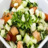 Shirazi Salad · Chopped cucumbers, tomatoes, fresh herbs and onions. Served with House dressing