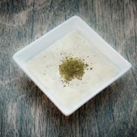 Large Must-o Khiyar · Yogurt mixed with chopped cucumbers and fresh herbs