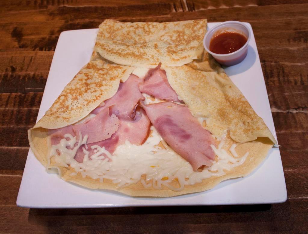 Ham and Cheese Crepe · Sliced smoked ham and choice of 
mozzarella or cheddar cheese.