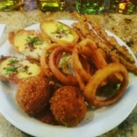 Clancy's Sampler · Irish spring rolls, potato skins with beer cheese, onion rings, mac and cheese balls, aspara...