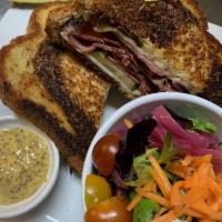 The O'Malley · Pastrami, whiskey mustard sauce, pickles, Swiss, marble rye.
