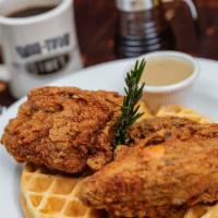 Fried Chicken Waffle · Belgian waffle topped with fried chicken strips and a side of gravy.