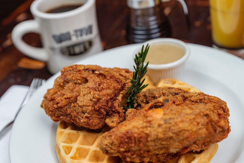 Fried Chicken Waffle · Belgian waffle topped with fried chicken strips and a side of gravy.