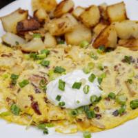 Baked Potato Omelette · Bacon bits, potato and cheddar cheese topped with sour cream and scallions.