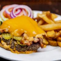 Iron Mac Burger · Bacon, pickles, 1000 Island dressing, and cheddar cheese.