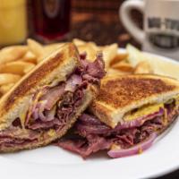 Georges Pastrami Sandwich · Grilled on your choice of bread with lean pastrami, melted Swiss cheese, yellow mustard, sau...