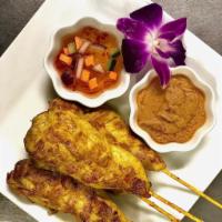 Chicken Satay · Grilled marinated chicken in bamboo skewers, served with peanuts sauce & cucumber rice vinge...