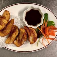 Thai Dumplings · Steamed or fried pork and vegetable Thai style ravioli - 5 pcs