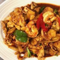 Siamese Twins · Chicken and shrimp, stir fried in hot sweet and sour sauce, with onions, pineapple, peppers,...