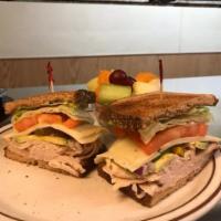 Turkey Sandwich · Sliced breast of turkey, lettuce, tomato, Swiss cheese and mayonnaise served on sourdough br...