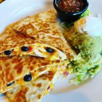 Wood-Fired Quesadilla · Toasted flour tortilla stuffed with cheddar-jack cheese and black bean corn salsa.  Served w...