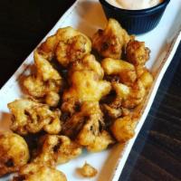 Cauliflower Wings · Beer battered and fried cauliflower served with Sriracha Ranch.