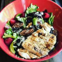 Raspberry Chicken Salad · Mixed greens tossed with crumbled blue cheese, fresh raspberries, candied pecans, dried cher...