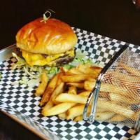 California Classic Cheeseburger · Two 1/4 lb griddle-seared Angus patties with a choice of American, Monterey Jack, pepper jac...