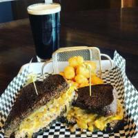 Patty Melt Burger · Two 1/4 lb griddle-seared Angus patties, melted American cheese and caramelized onion on gri...