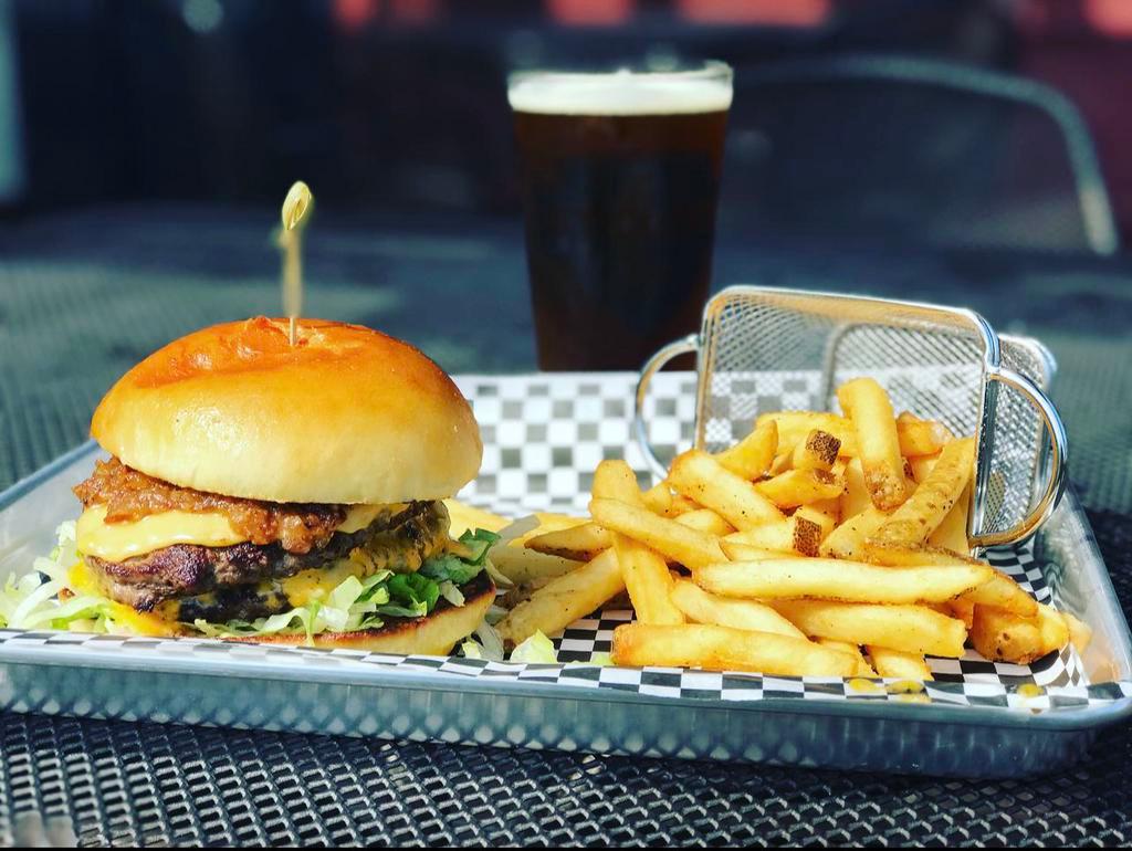 The Proud Stout Burger · Two 1/4 lb griddle-seared Angus patties with smoked gouda, American cheese and shredded lettuce.  Topped with Stout's homemade bacon jam.