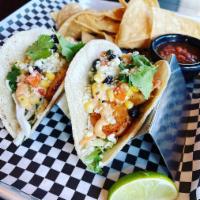 Blackened Shrimp Tacos · Two shrimp tacos with cilantro slaw, Cotija cheese, black-bean-cilantro corn, chipotle aioli.