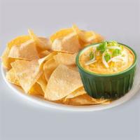 Sriracha Shrimp Dip · This hearty dip features a blend of pepper jack and parmesan cheeses with seasoned shrimp, s...