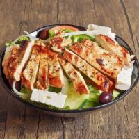 Greek-Style Chicken Breast Salad · Marinated chicken breast on a mix of romaine and iceberg lettuce, with onions, green peppers...