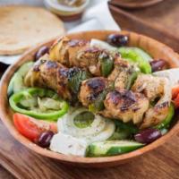 Chicken Kebab Salad · 2 skewers of marinated chicken breast, on a mix of romaine and iceberg lettuce, green pepper...