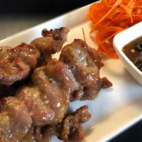 Grilled Pork Skewers (4) · Marinated Pork on Skewers | Sticky Rice | Tamarind Sauce
