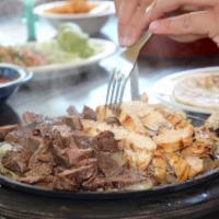 Sizzling Fajitas · Tender, juicy strips of char-broiled Beef or Chicken with sauteed peppers and onions. Served...