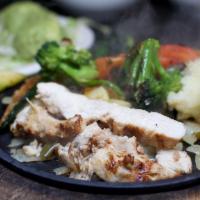 Chicken & Vegetable Fajitas  · Grilled fresh vegetables and tender strips of char-broiled chicken on a bed of sauteed peppe...