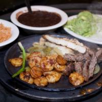 Fajita Trio · A combination of our famous charbroiled beef, chicken and shrimp all on one sizzling skillet...