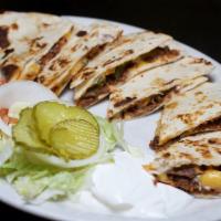 Brisket Quesadillas · Chopped beef brisket, melted American and Monterey Jack cheese and fresh pico de gallo, laye...