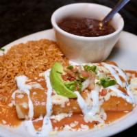 Shrimp Enchilada Dinner · Seasoned grilled shrimp and Pepper-Jack cheese rolled in two enchiladas, topped with rancher...