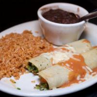 Vegetable Enchiladas  · A mix of lightly seasoned grilled veggies and melted Chihuahua cheese rolled inside soft cor...