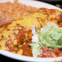Burrito Dinner  · Fresh flour tortilla filled with Beef smothered in chile con carne or chicken smothered in r...