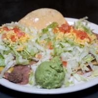 Chalupa Dinner  · Crisp corn tortillas spread with beans, cheese, shredded lettuce, and tomatoes. Served with ...