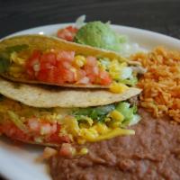 Taco Dinner · Two Soft or Crispy tacos filled with seasoned Beef or Chicken, lettuce, tomato, and shredded...